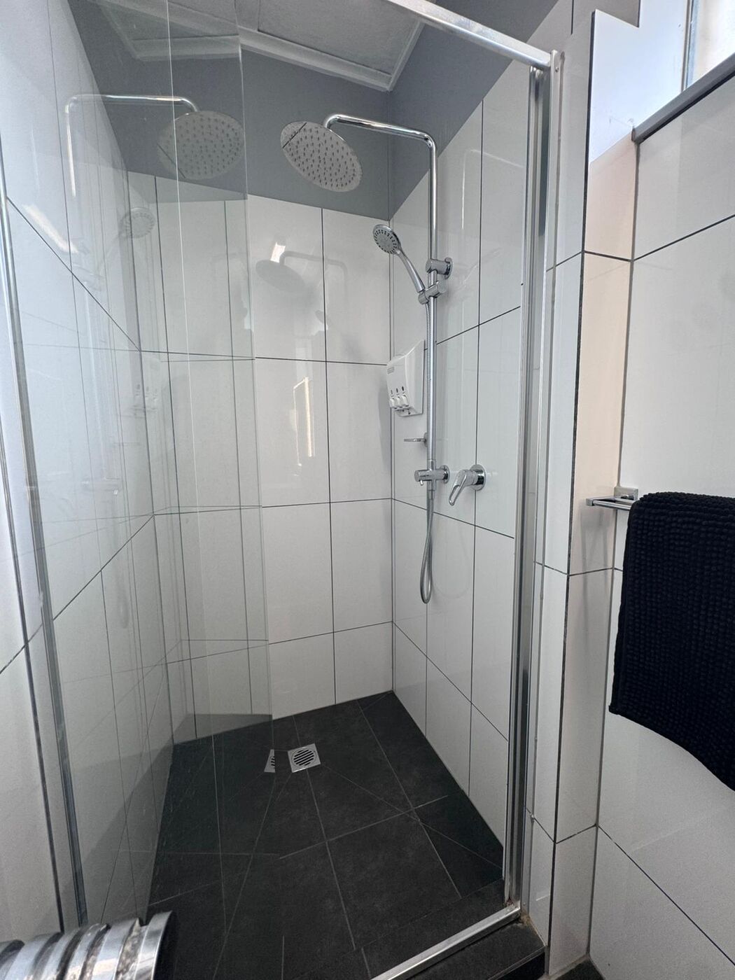 Rainfall shower with glass screen